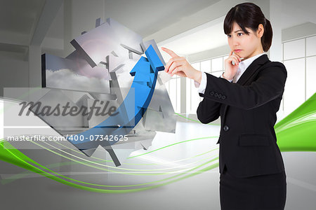 Thoughtful businesswoman pointing against abstract white and green line design in room