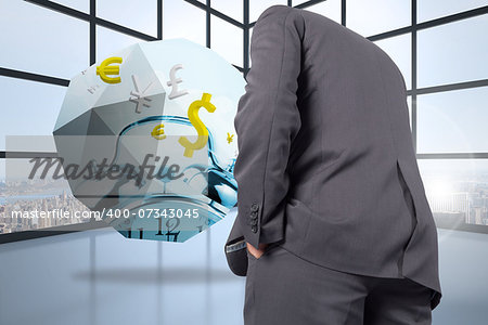 Thinking businessman against room with large windows showing city