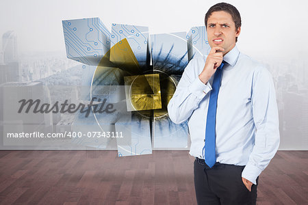 Thinking businessman touching his chin against city scene in a room