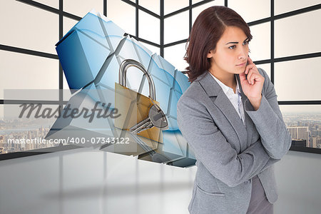 Focused businesswoman against room with large window showing city