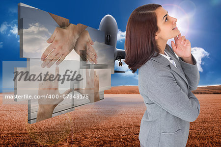 Smiling thoughtful businesswoman against 3d plane taking off over cornfield