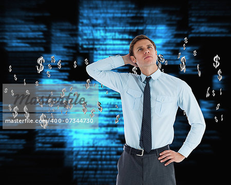 Thoughtful businessman with hand on head against blue blurred texts