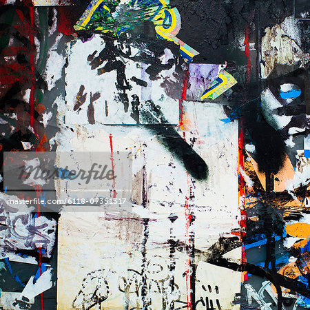A graffiti covered wall in a city. Streaks of paint drips and spray paint tags. A graffiti covered wall in a city. Streaks of paint drips and spray paint tags.
