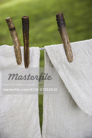 A washing line with household linens and washing hung out to dry in the fresh air.