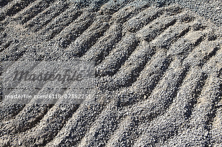 Gravel piles are used for road maintenance and construction purposes. Gravel piles are used for road maintenance and construction purposes.