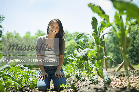 A young woman on a traditional farm in the countryside of New York State, USA