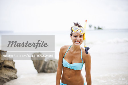 A young woman wearing snorkelling gear on the Samana Peninsula in the Dominican Republic.
