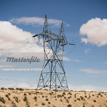 A tall pylon carrying power lines, in the desert near Tucson.