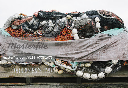 Commercial fishing nets stacked on the dockside at Fisherman's Wharf, Seattle.