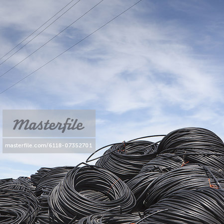 Heap of coiled plastic irrigation tubing.