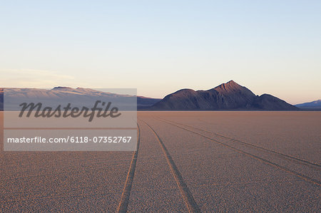 Tyre marks and tracks in the playa salt pan surface of Black Rock Desert, Nevada. Tyre marks and tracks in the playa salt pan surface of Black Rock Desert, Nevada.