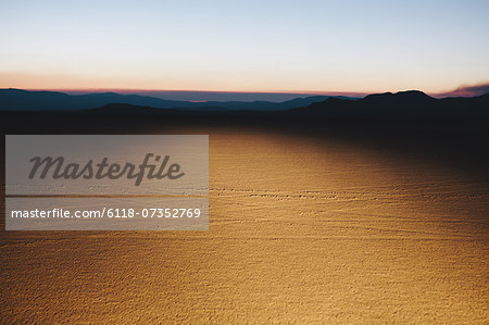 Illuminated desert landscape, dusk