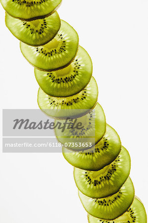 Organic kiwi slices, white background Organic kiwi slices, white background