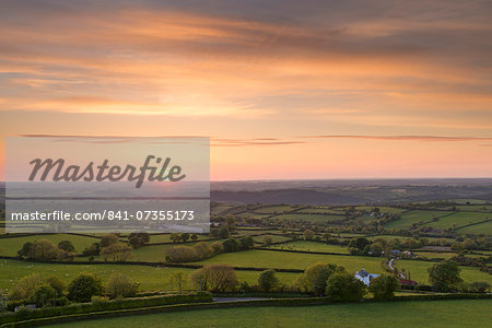 Sunset over beautiful rolling Devon countryside in summer, Devon, England, United Kingdom, Europe Sunset over beautiful rolling Devon countryside in summer, Devon, England, United Kingdom, Europe