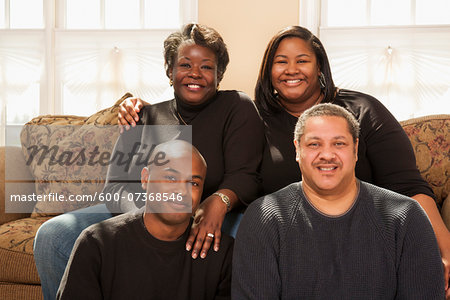 Portrait of Adult Family on Sofa