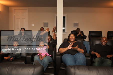 Extended Family Watching Movie in Home Theater