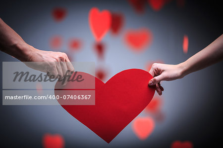 Two hands holding heart