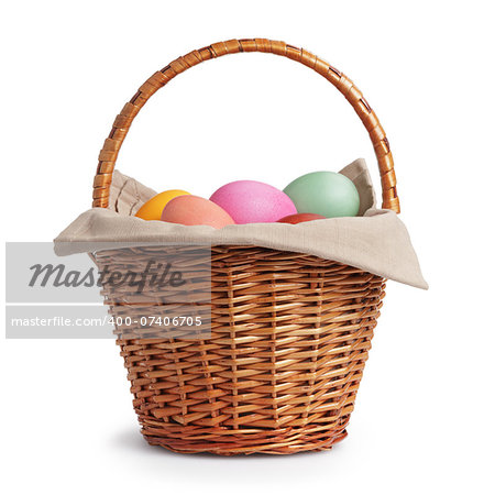 wicker basket full of pastel colors easter eggs, white background