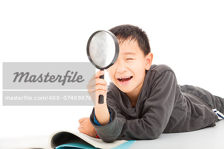 happy kid with magnifying glass and book