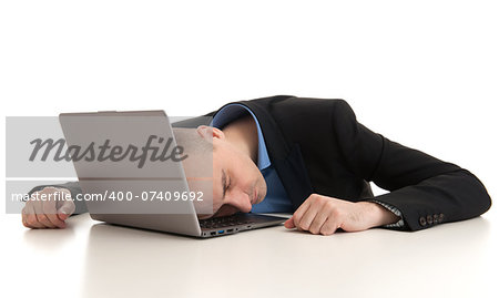 stressed businessman sleeping on a laptop. Studio shot