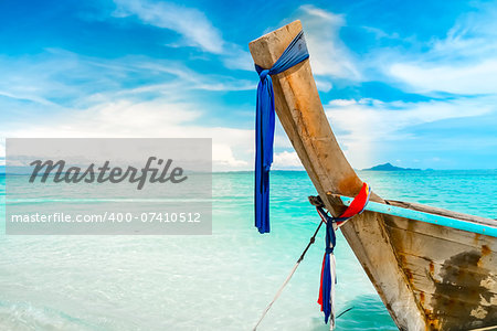 long boat, blue sky, clear water in Thailand