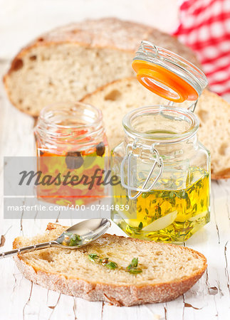 Aromatic olive oil with thyme and fresh bread.