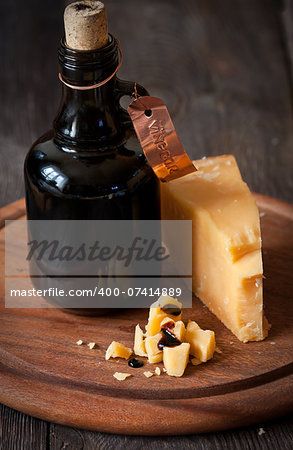 Delicious parmesan cheese and bottle of old balsamic vinegar