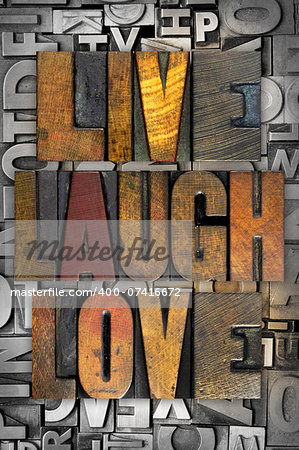 The words LIVE LAUGH LOVE written in vintage letterpress type