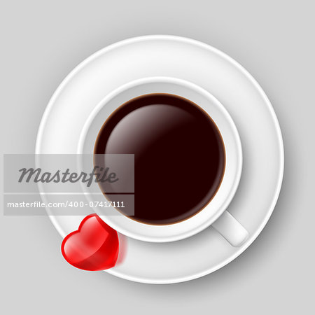 Cup of coffee with small red heart on saucer