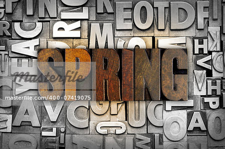 The word SPRING written in vintage letterpress type