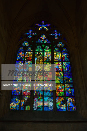 Stained glass in the St. Vitus Cathedral in Prague. Is a Roman Catholic cathedral