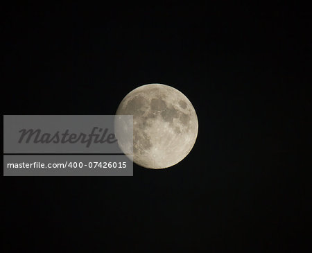 Waxing gibbous moon showing craters and seas.