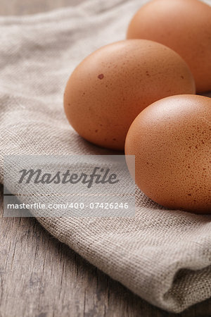 speckled chicken eggs or old table, rustic style