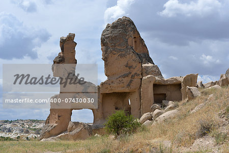 Rock similar to animal (hare) is situated against the sky background. Wind,  people and time have created such stone formation in the Cappadocia (near Goreme).