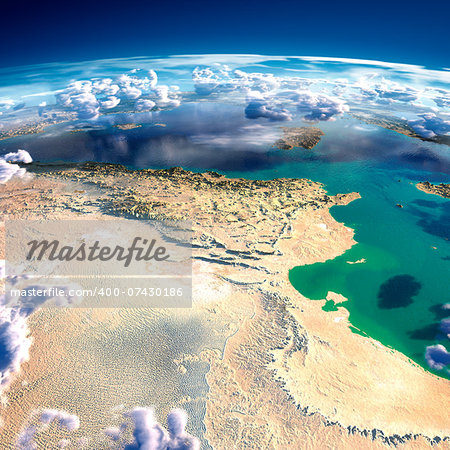 Highly detailed fragments of the planet Earth with exaggerated relief, translucent ocean and clouds, illuminated by the morning sun. Tunisia. Elements of this image furnished by NASA