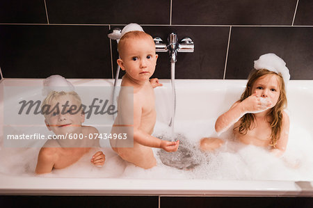 Three Children having Bath in Bathtub