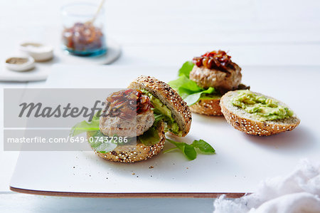 Still life of chicken and avocado burgers Still life of chicken and avocado burgers