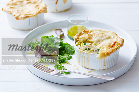 Still life of chicken, leek and pea pies