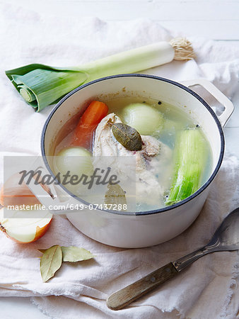 Still life of chicken stock in saucepan