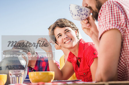 Group of friends enjoying breakfast outdoors