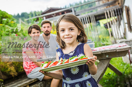 Young family preparing picnic lunch, Tyrol, Austria