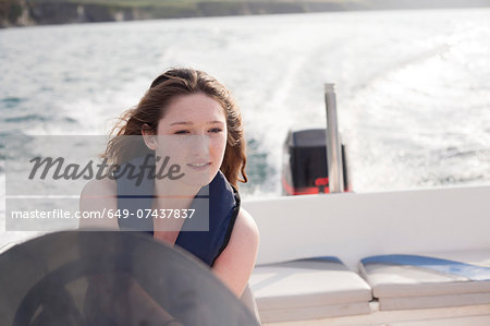 Teenager driving speedboat