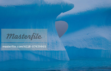 Icebergs with eroding and changing form drifting on the water, Antarctica