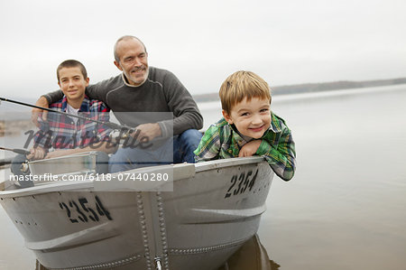 A day out at Ashokan lake. A man and two boys fishing from a boat.
