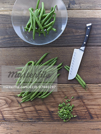 Organic Green Beans Being Prepared for Cooking on Reclaimed Lumber Counter Top Organic Green Beans Being Prepared for Cooking on Reclaimed Lumber Counter Top