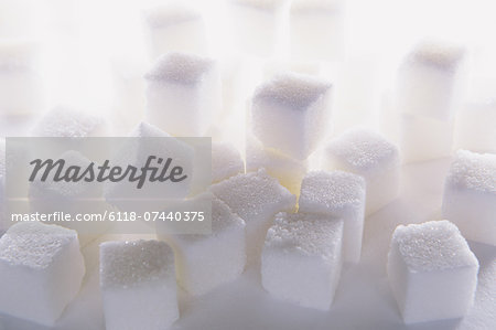 Sugar cubes on white backdrop