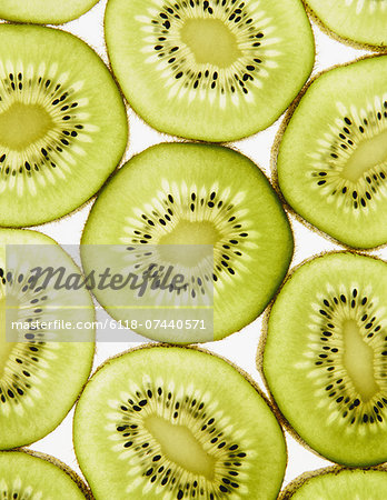 Organic kiwi slices, white background