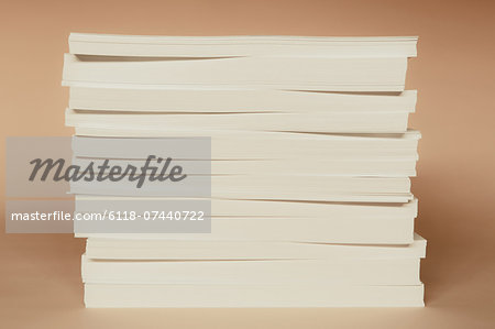 A stack of recycled white paper, paper supplies.