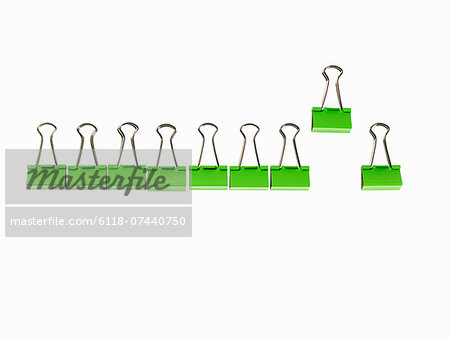 Green Office Supplies. Paperclips on a white background.