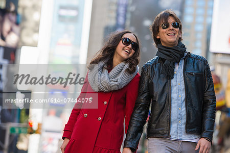 Young tourist couple holding hands, New York City, USA